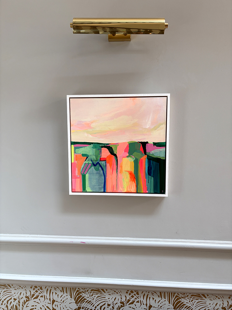 Artwork showing a pastel sky and colourful land